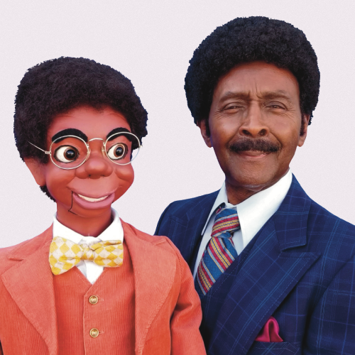 Willie Tyler and his ventriloquist dummy Lester, sporting classy suits and afros